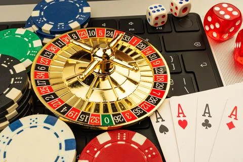 A captivating casino scene featuring roulette, playing cards, dice, and chi.. Stock Photos