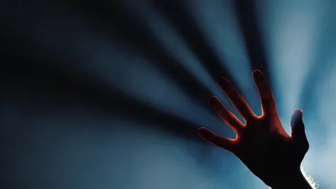 A captivating cinematic close-up shot of a human hand gracefully reaching a.. Stockbeeldmateriaal 334519905