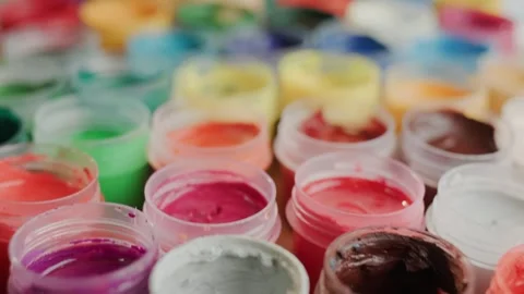 A captivating close up shot shows an array of vibrant watercolor paints in .. Stock Footage 334712135