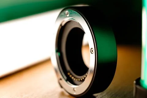 Captivating close-up of a sleek camera lens adapter showcasing fine details 库存照片