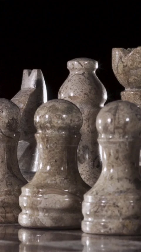 Captivating Close-Up of Stone Chess Pieces Conveying Strategy and Elegance Stock Footage 338141808
