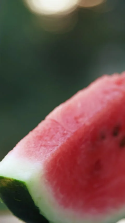 Captivating close-ups showcase its vibrant red flesh, glistening with juiciness Stock Footage 280826456