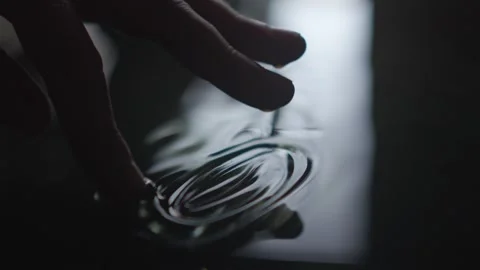 A Captivating CloseUp of Water Surface Interaction with artistic qualities and Stock Footage 313283432