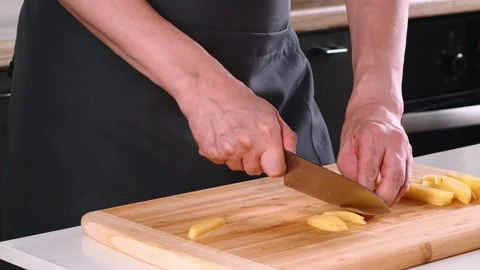 Captivating culinary moments showcase skillful slicing of fresh ginger in a Video stock 316636707