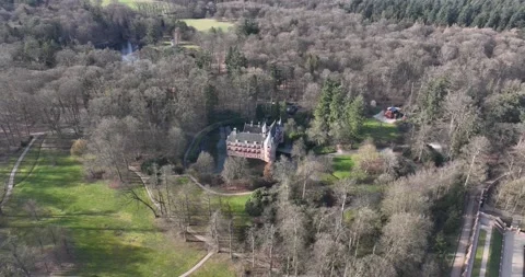 Captivating drone video of Het Oude Loo palace, highlighting the intricate Stock Footage 237079002