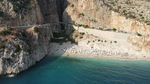 A Captivating Drone View of a Beach Nestled Among Majestic Mountains Stock Footage 240309949