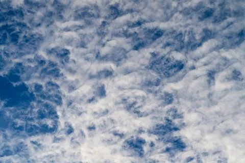 Captivating Dynamic Cloud Patterns Forming Beautifully Against a Bright Blue Sky Stock Photos