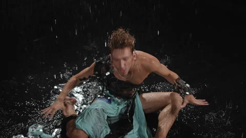 A captivating Dynamic Water Dance Performance showcasing dramatic expressions Stock Footage 313628797