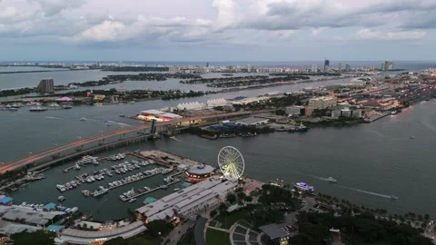 Captivating evening view of Miami Downtown with waterfront infrastructure and Stock Footage 254438169