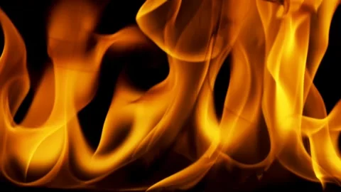 Captivating Flames Dance Against a Dark Backdrop in Fiery Display Vídeo Stock 341920294
