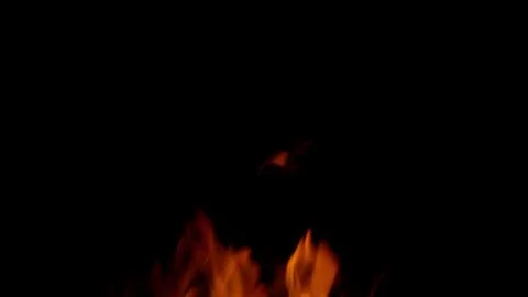 The Captivating Flames Dancing Elegantly in the Dark Night Sky Create an Enchant 写真素材