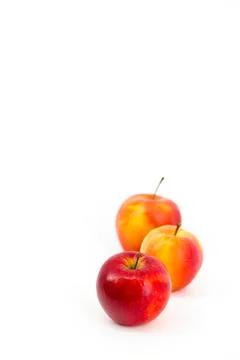 A captivating image featuring vibrant red apples set against a pristine whi.. Stock Photos