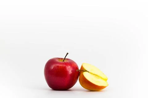 A captivating image featuring vibrant red apples set against a pristine whi.. Stock Photos