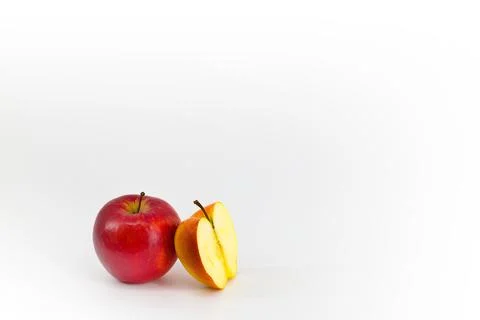 A captivating image featuring vibrant red apples set against a pristine whi.. Stock Photos