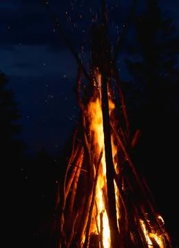 Captivating image of a massive conical bonfire during the Ivan Kupala celebra Stock Photos