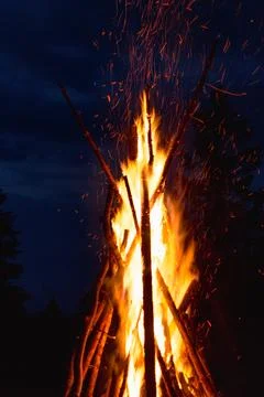 Captivating image of a massive conical bonfire during the Ivan Kupala celebra Stock Photos