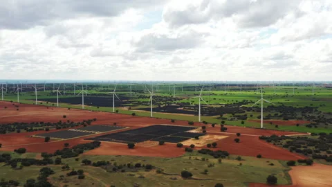 Captivating Landscapes Showcasing Wind Turbines and Solar Panels in Vast Fields Stock Footage 344911806