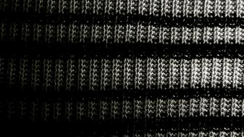 Captivating macro closeup of black and white striped knitted fabric with intr Stock-Fotos