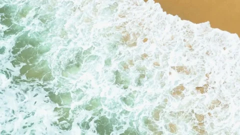 The captivating motion of sea waves crashes onto the shore. Stock Footage 308055443