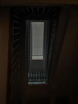 A Captivating Perspective of a Stairwell's Interior Featuring Unique Lines .. Foto stock