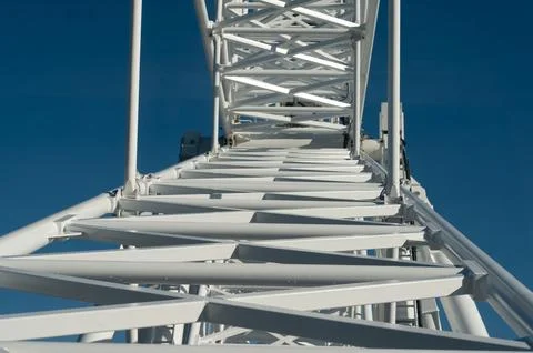 Captivating perspective of a towering structure reaching into a vivid blue sk 스톡 사진