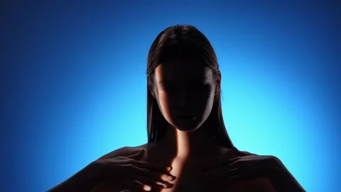 Captivating Portrait with Dramatic Shadow Play and Light Beam Stock Footage 310498249