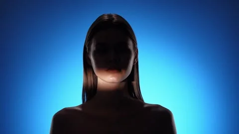 Captivating Portrait with Dramatic Shadow Play and Light Beam Stock Footage 310498268