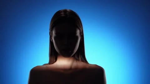 Captivating Portrait with Dramatic Shadow Play and Light Beam Stock Footage 310498279