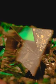 Captivating reflections of light through a glass prismatic pyramid in darkness Stock Photos