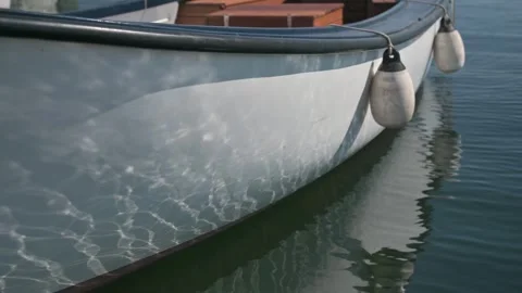 Captivating Ripple Reflections on a white boat. Stock Footage 247817997