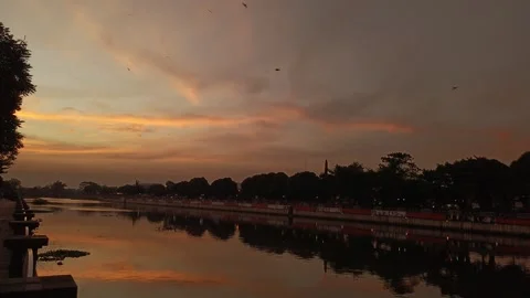 Captivating river at dusk showcasing the peaceful atmosphere of nature Stock Footage 313286073