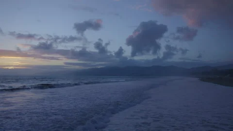 Captivating sea waves at twilight during a peaceful dusk by the shore Stock Footage 312768468