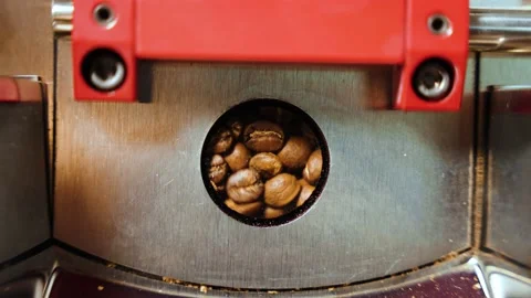 This captivating shot shows a machine roasting coffee beans to perfection. Stock Footage 239927217