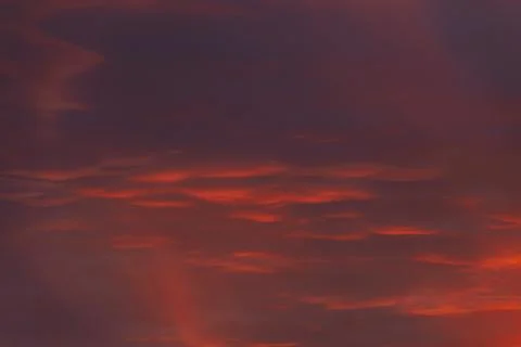 A captivating sky at sunset with dark red and orange clouds Stock Photos