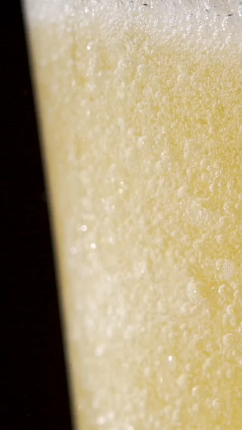 Captivating Slow Motion Beer Foam and Bubbles in Perfect Harmony Stock Footage 340078879