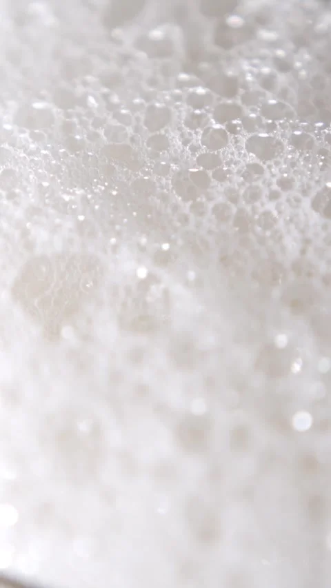 Captivating Slow Motion of Beer Foam and Bubbles Bursting Stock Footage 340078922