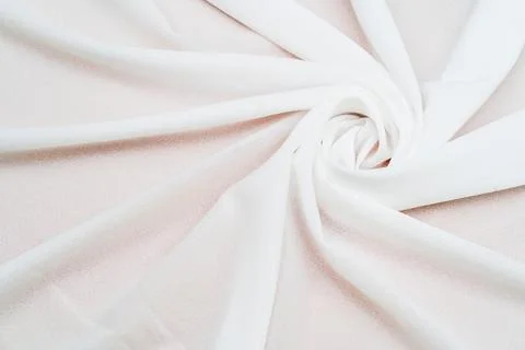 A captivating spiral shape is emphasized in a mockup image of a cloth arran.. Stock Photos