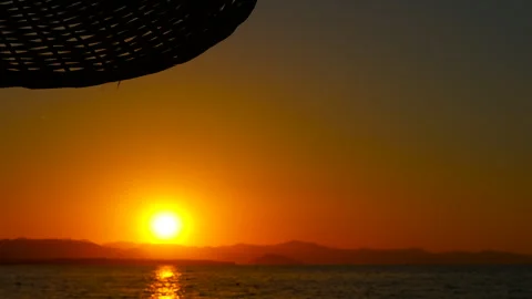Captivating sunset illuminating ocean waters with warm orange hues Stock Footage 308574351