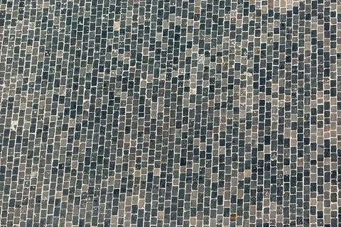 A Captivating Textured Mosaic Pattern Created from Dark Blue Tiles Foto stock