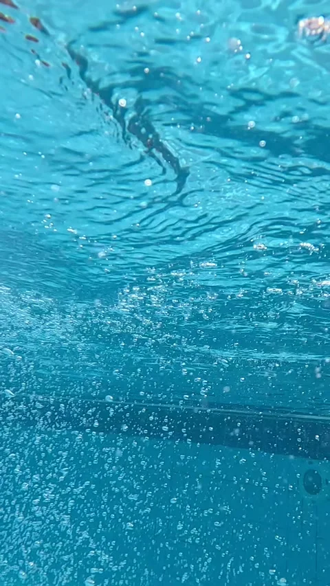 Captivating Underwater Scenes Showcasing Shimmering Blue Water and Bubbles, Stock Footage 330096131