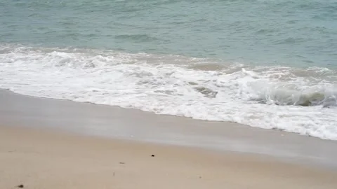 Captivating Video of Gentle Waves Caressing the Shoreline Stock Footage 244749488