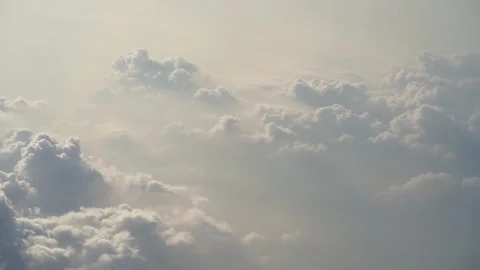 Captivating View of Beautiful White Clouds from Inside an Airplane Stock Footage 244748534