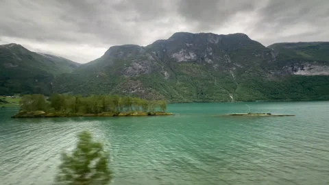 A captivating view of dynamic mountains framed by foliage Video stock 313947319