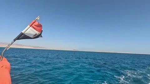 A Captivating View of the Egyptian Flag Displayed Off the Coastline, Surrounded Stock Footage 331054545
