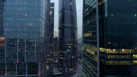 Captivating view of high rise building, office skyscrapers at night. Aerial. Stock Footage 77731139