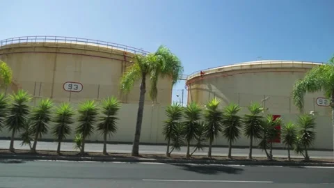 Captivating view from a moving vehicle showcasing towering silos under the .. Stock Footage 268431543