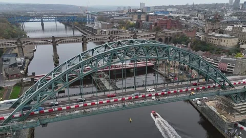 Captivating view of Newcastle upon Tyne's iconic bridge and bustling river Stock Footage 296010577