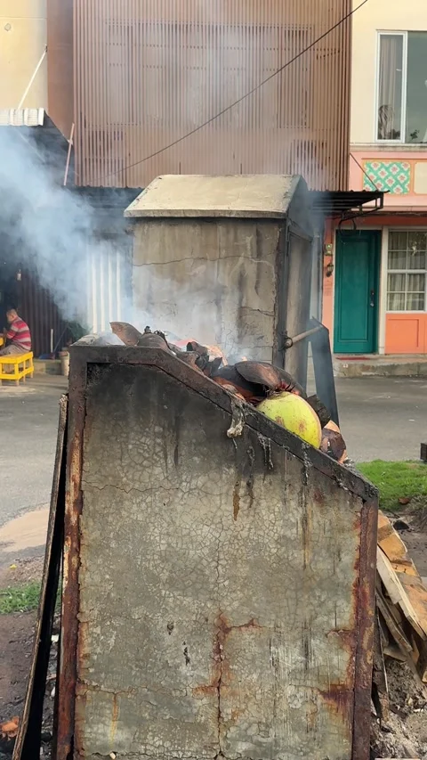 Captivating view of an open-air smoker creating a hazy atmosphere in a vibr.. Video stock 325233750