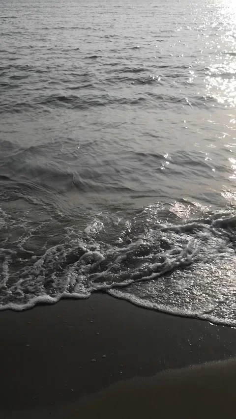 Captivating View of Small Waves on the Beach at Dusk Stock Footage 277174436