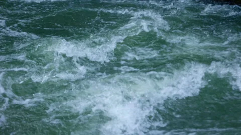 A Captivating View of Turbulent River Waters: The Dynamic Dance of Waves and Stock Footage 314393313
